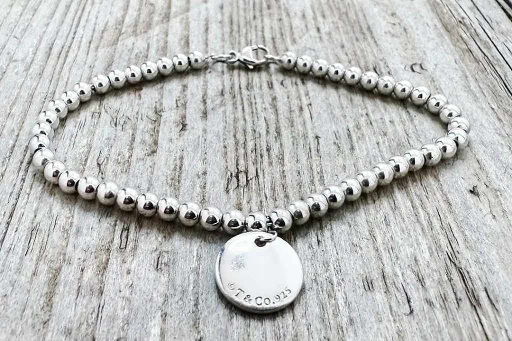 After Tiffany Blue heart tag bead bracelet repair showing re-threaded beads and laser link repair